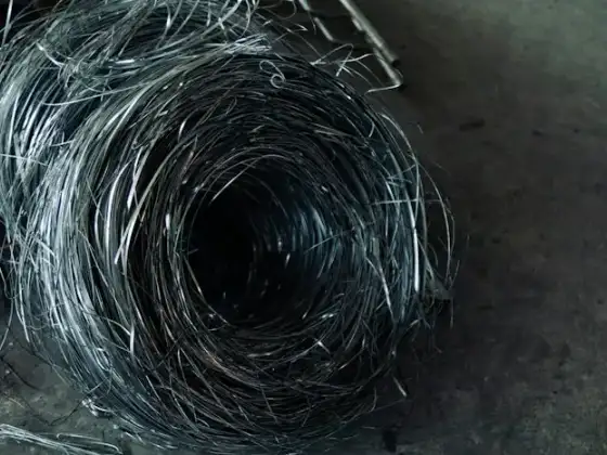 Wire lying in coils on a floor
