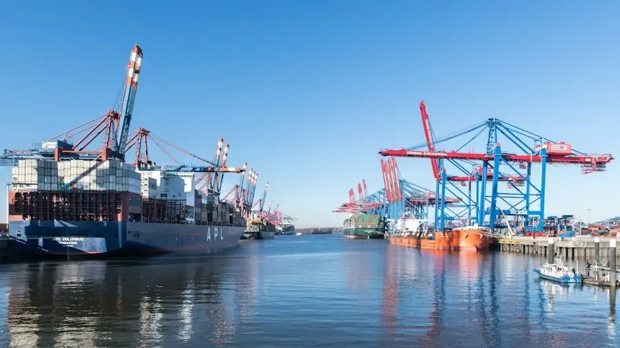 Container ship at a port with cranes